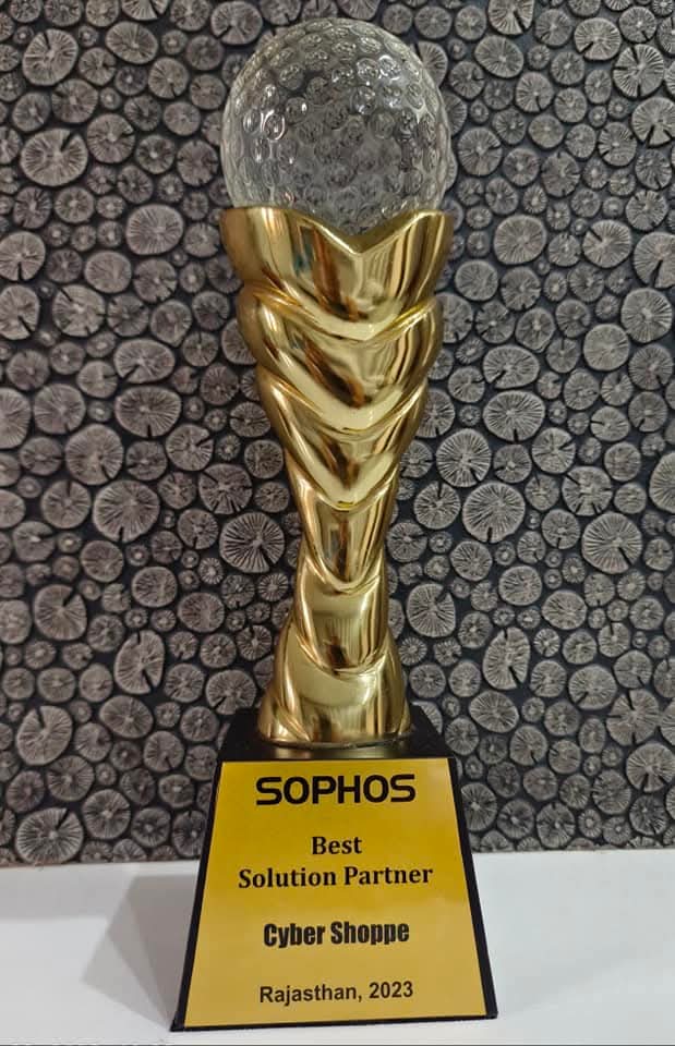 A gold trophy holding a crystal globe, plaque reading "Sophos — Best Solution Partner — Cyber Shoppe — Rajasthan, 2023".
